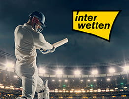 ένα κρίκετ στιγμιότυπο και το λογότυπό του interwetten